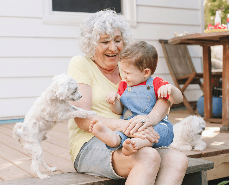 A woman and child with their dogs