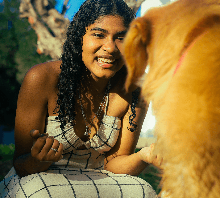 Animal rescue volunteer with a dog — Guardian Pet Trust non-profit partner program