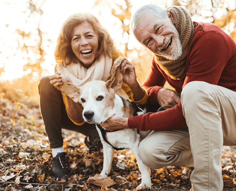 An older couple with their dog