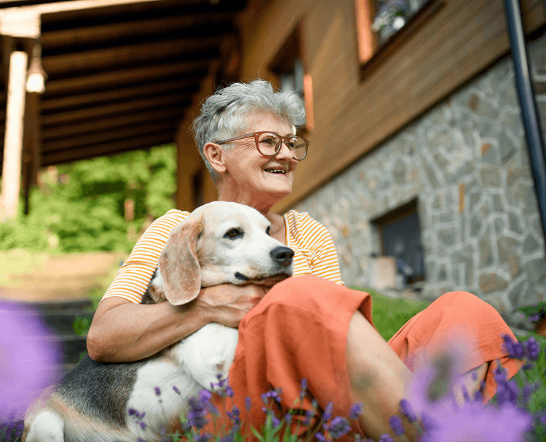 A woman holding her dog